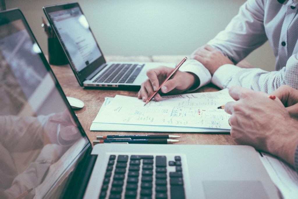 Business documents and charts on a desk during a planning session