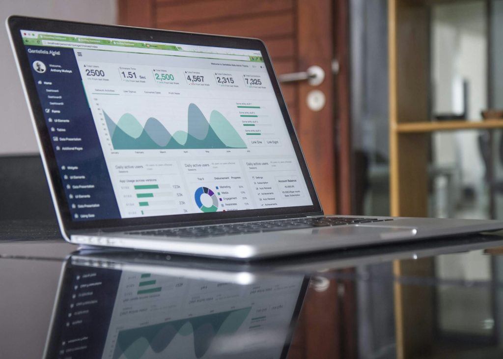 Charts and business analytics on a laptop screen