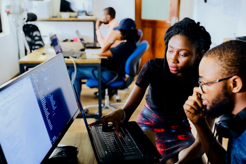Two colleagues having a conversation in an office
